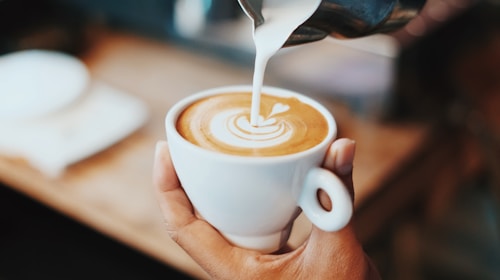 Latte with art in a glass cup